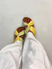 Momoc Calpe yellow green pastel knotted sandals worn front view white trousers cork sole sustainable Spain | Momoc Shoes Spain