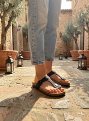Momoc Altea black raffia thong sandal side view light blue jeans cork sole Spain | Momoc Shoes Spain