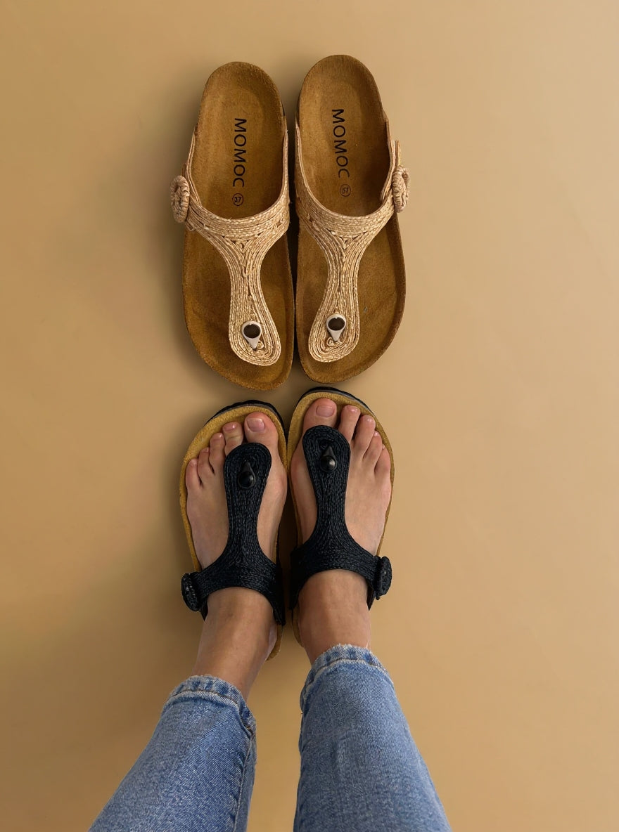 Momoc Altea black raffia sandal top view both feet light jeans zero waste Spain | Momoc Shoes