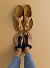 Momoc Altea black raffia sandal top view both feet light jeans zero waste Spain | Momoc Shoes