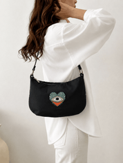 Momoc A Glance Hobo black bag worn model white top back view shoulder bag sustainable Spain | Momoc Shoes Spain