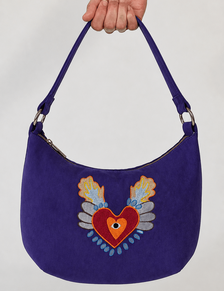 Momoc Te Recuerdo Hobo violet ultrasuede handbag front view sacred heart embroidery wings eye handmade Spain | Momoc Shoes