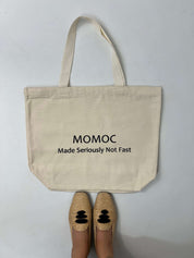 Momoc Seriously Not Fast tote bag lifestyle floor view with raffia ballet flats slow fashion | Momoc Shoes