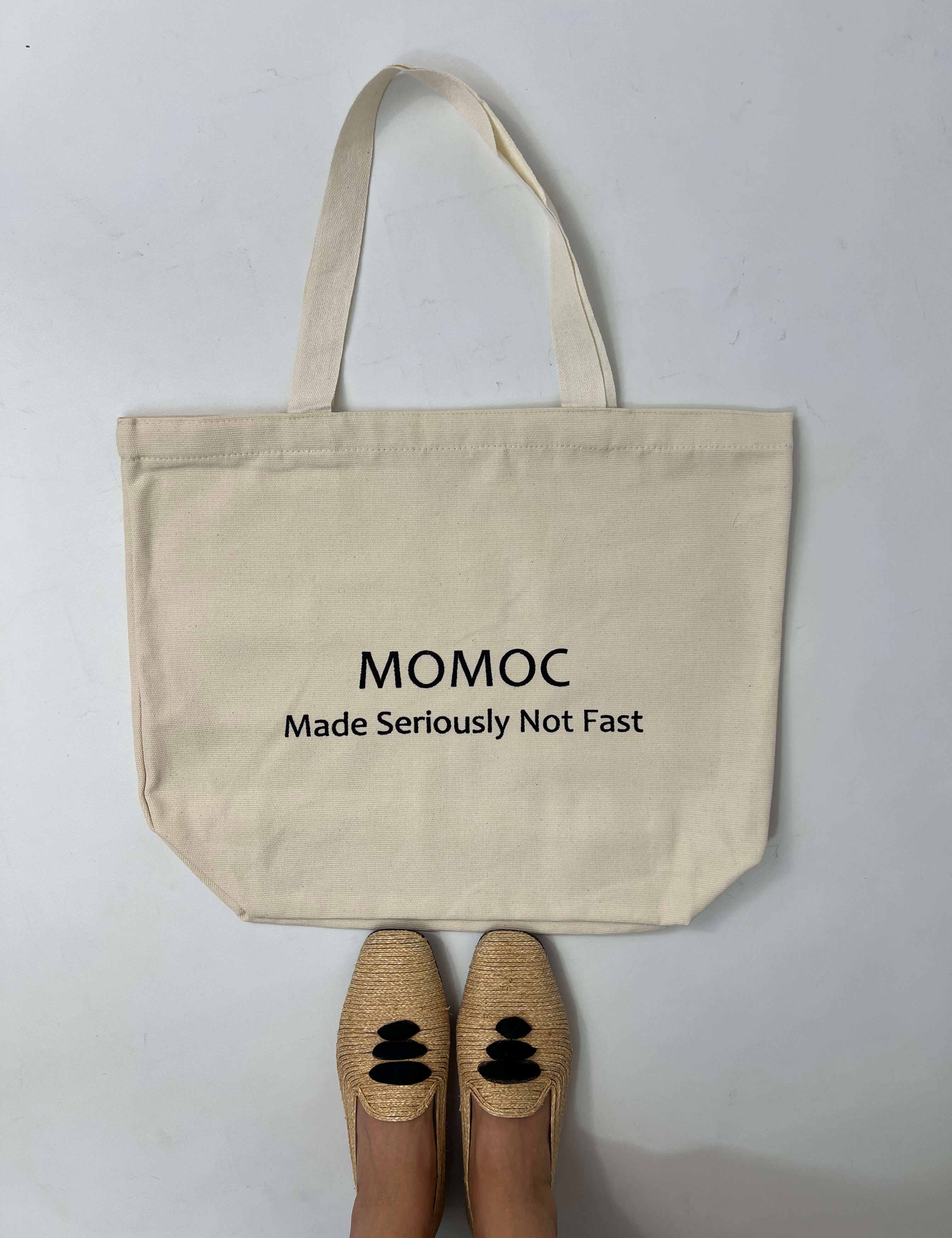 Momoc Seriously Not Fast tote bag lifestyle floor view with raffia ballet flats slow fashion | Momoc Shoes