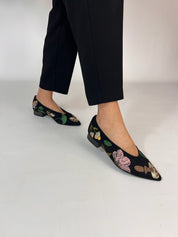 Multicolor embroidered ballet flats worn walking black trousers | Momoc Shoes Spain