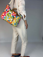 Momoc Frigiliana Mosaic Bamboo bag worn shoulder strap white trousers side view handmade | Momoc Shoes Spain