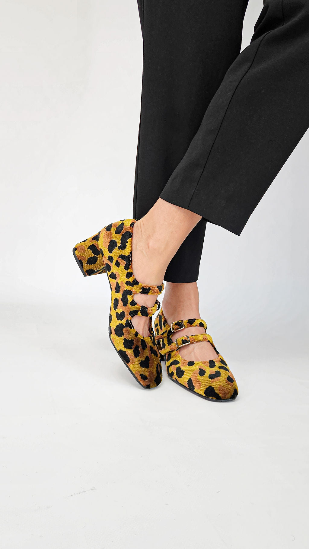 Momoc Bardot leopard velvet midi heels worn front view black trousers both feet Spain | Momoc Shoes