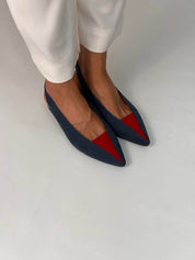 Momoc Luna backless sandals pair side view petrol blue red toe pink insole with white trousers and white background | Momoc Shoes Spain