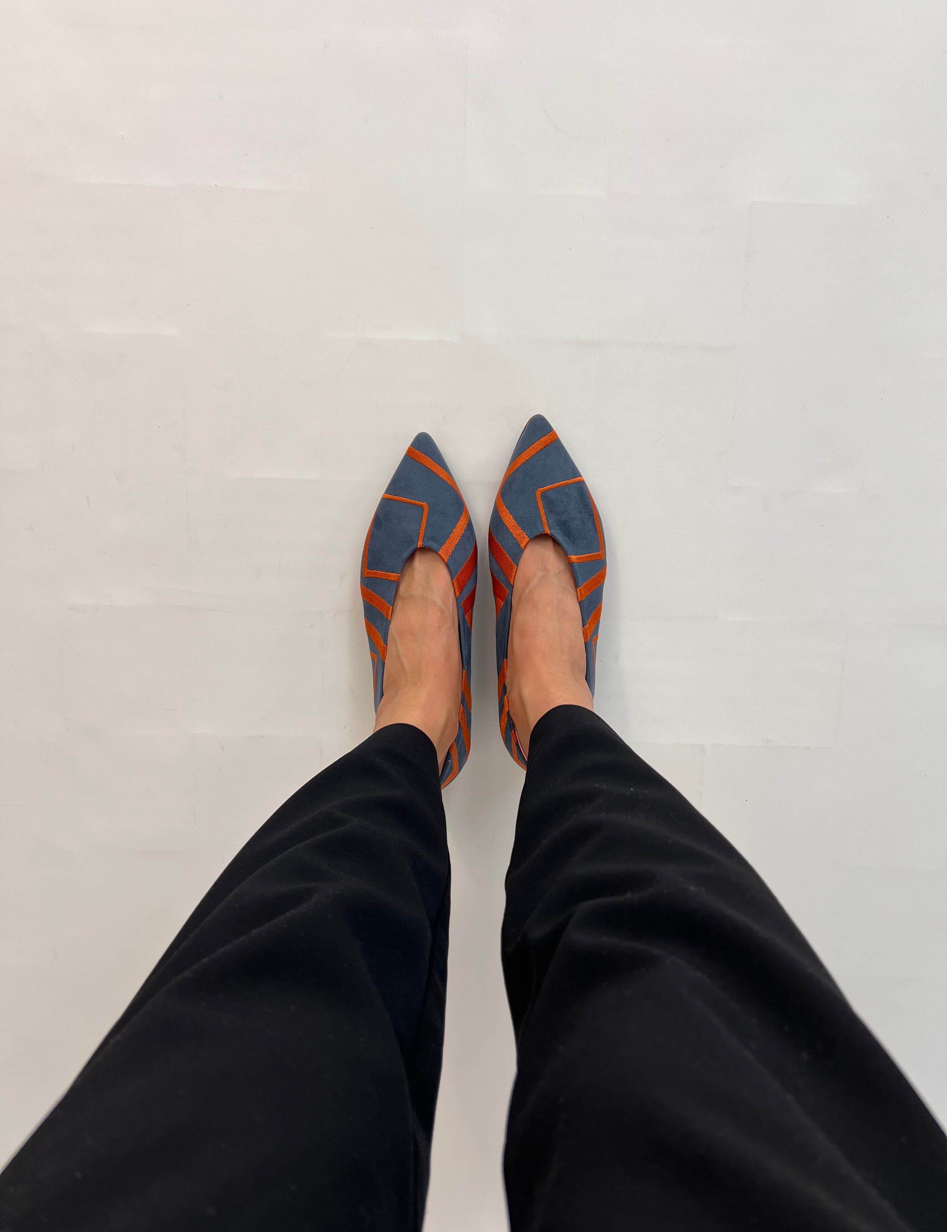 Momoc Midnight Funk blue flat worn top view black trousers orange geometric pattern | Momoc Shoes