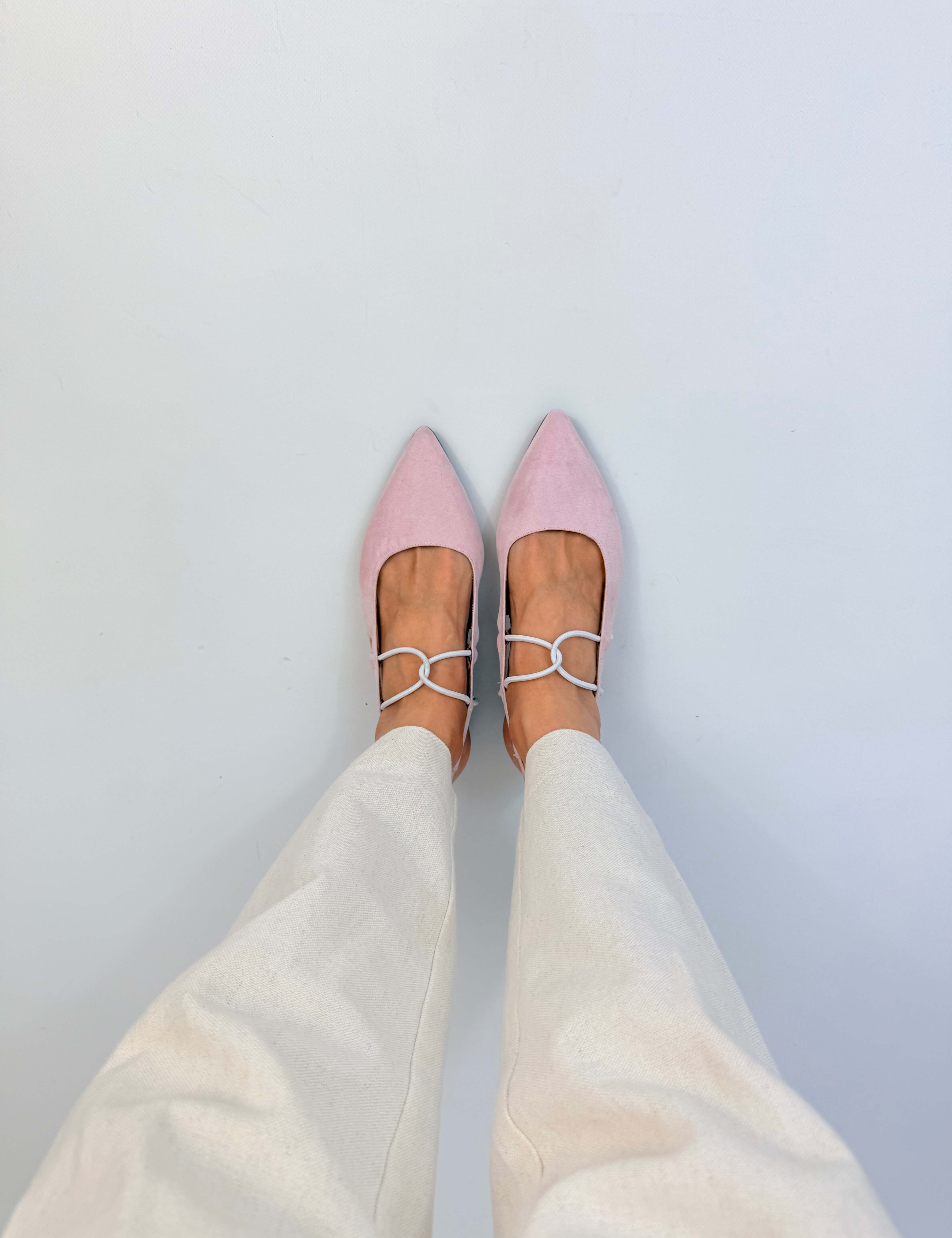 Momoc Menorca pink sandals worn crossed feet top view white trousers pointed toe vegan Spain | Momoc Shoes Spain