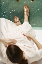 Momoc Biar wheat sandals worn model lifestyle towel relaxing scene summer Spain | Momoc Shoes