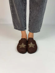 Momoc A Star Chocolate clogs worn top view feet grey jeans gold studded star pattern | Momoc Shoes