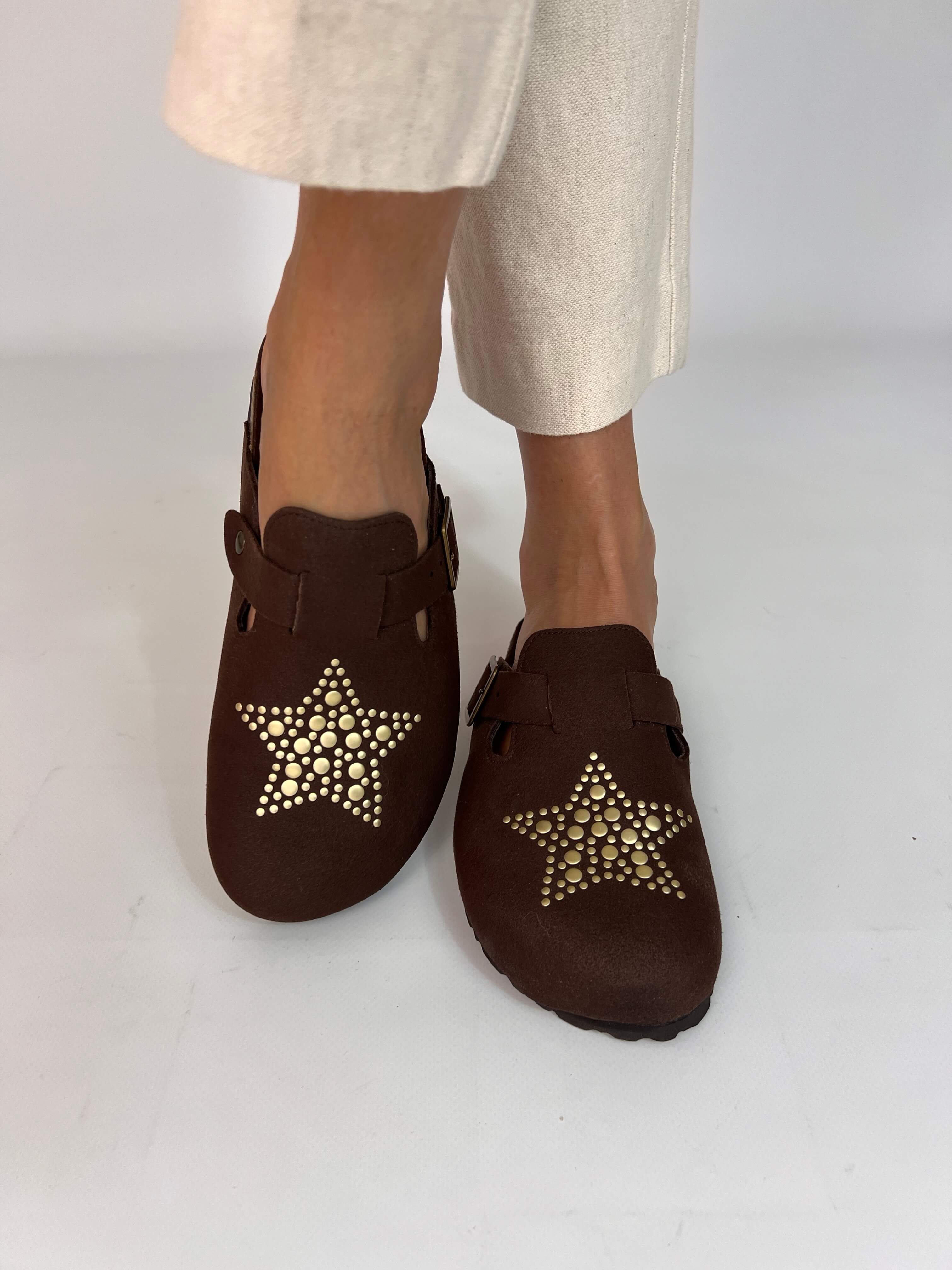 Momoc A Star Chocolate clogs worn cream trousers gold star studs platform clog Spain | Momoc Shoes Spain