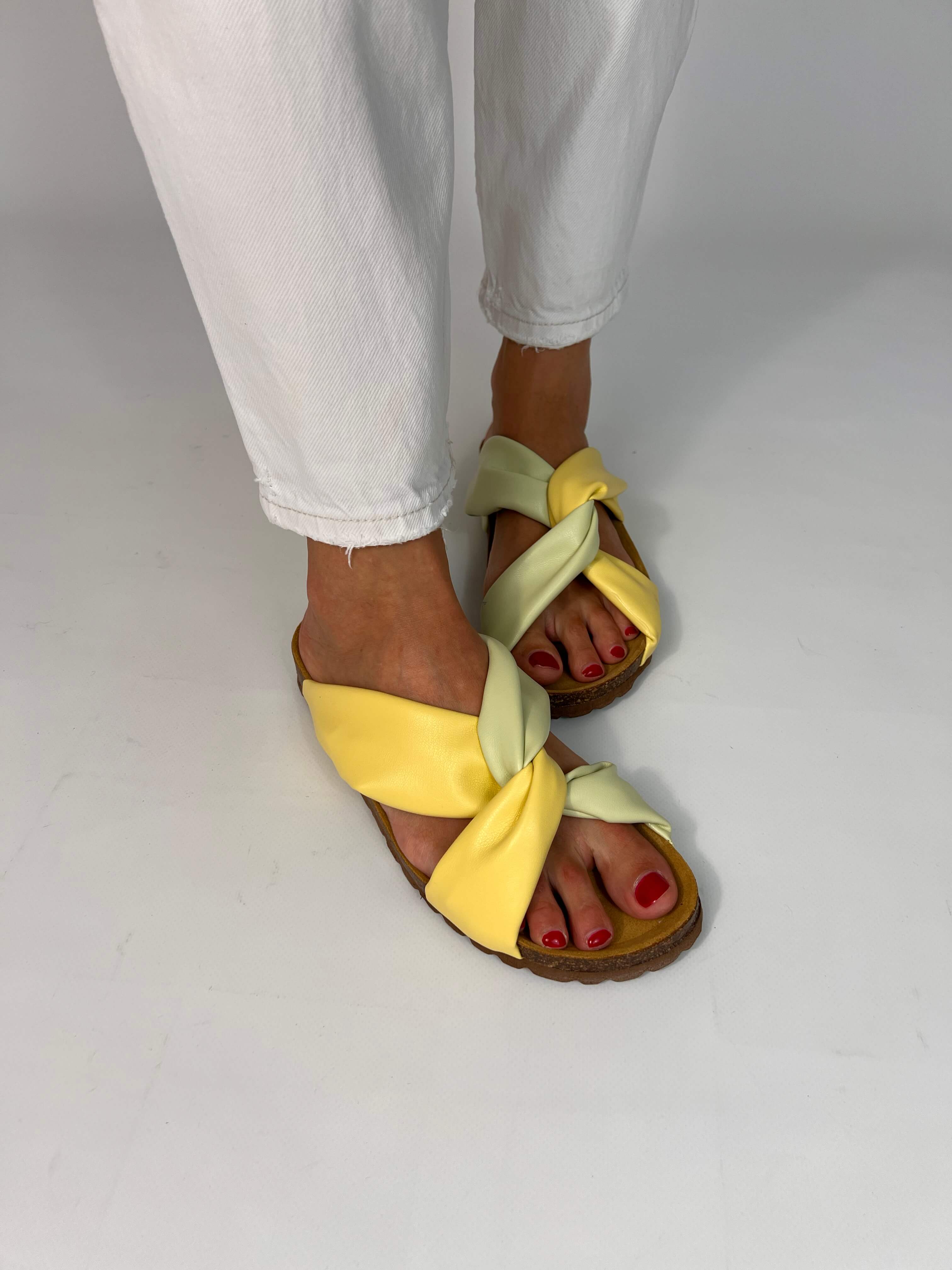 Momoc Calpe butter yellow pistachio sandals worn top view white jeans both feet vegan Spain | Momoc Shoes