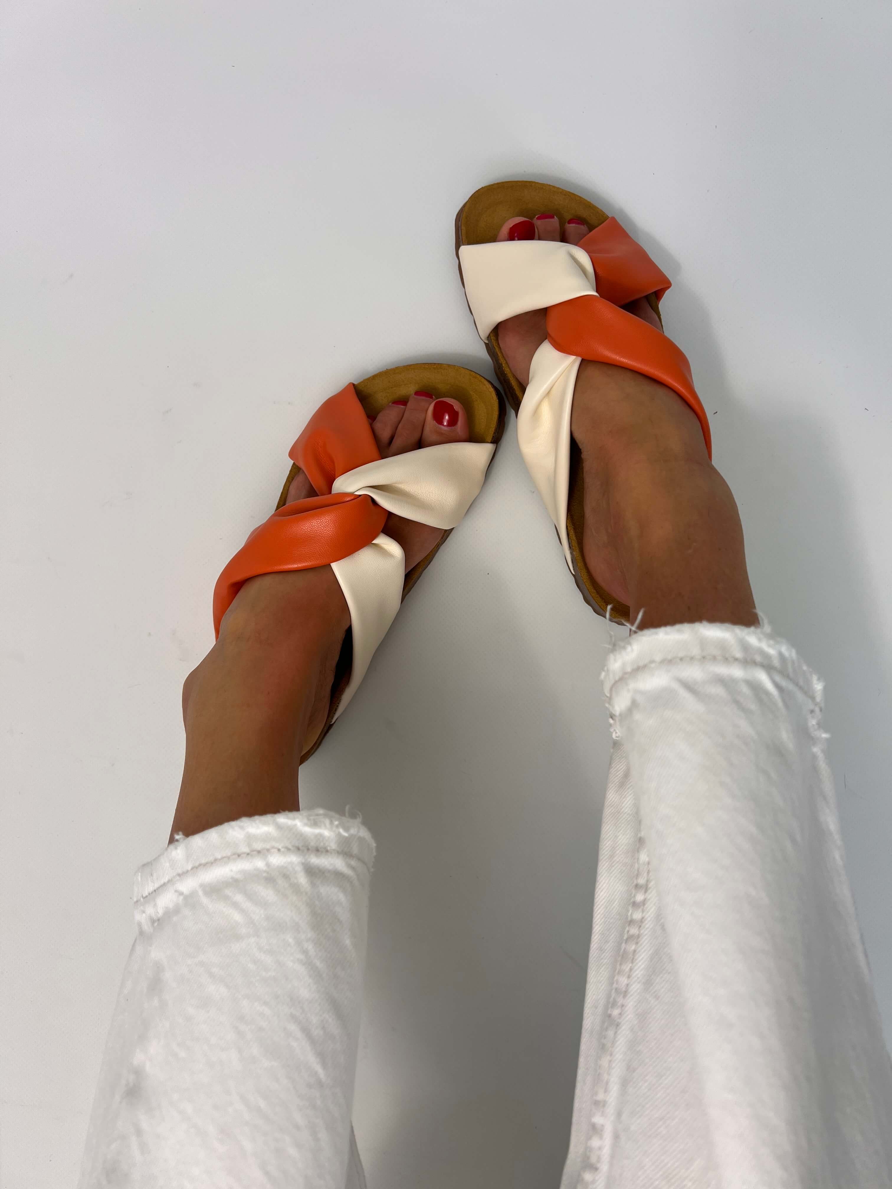 Momoc Calpe orange cream knotted sandals worn top view white jeans both feet vegan Spain | Momoc Shoes Spain