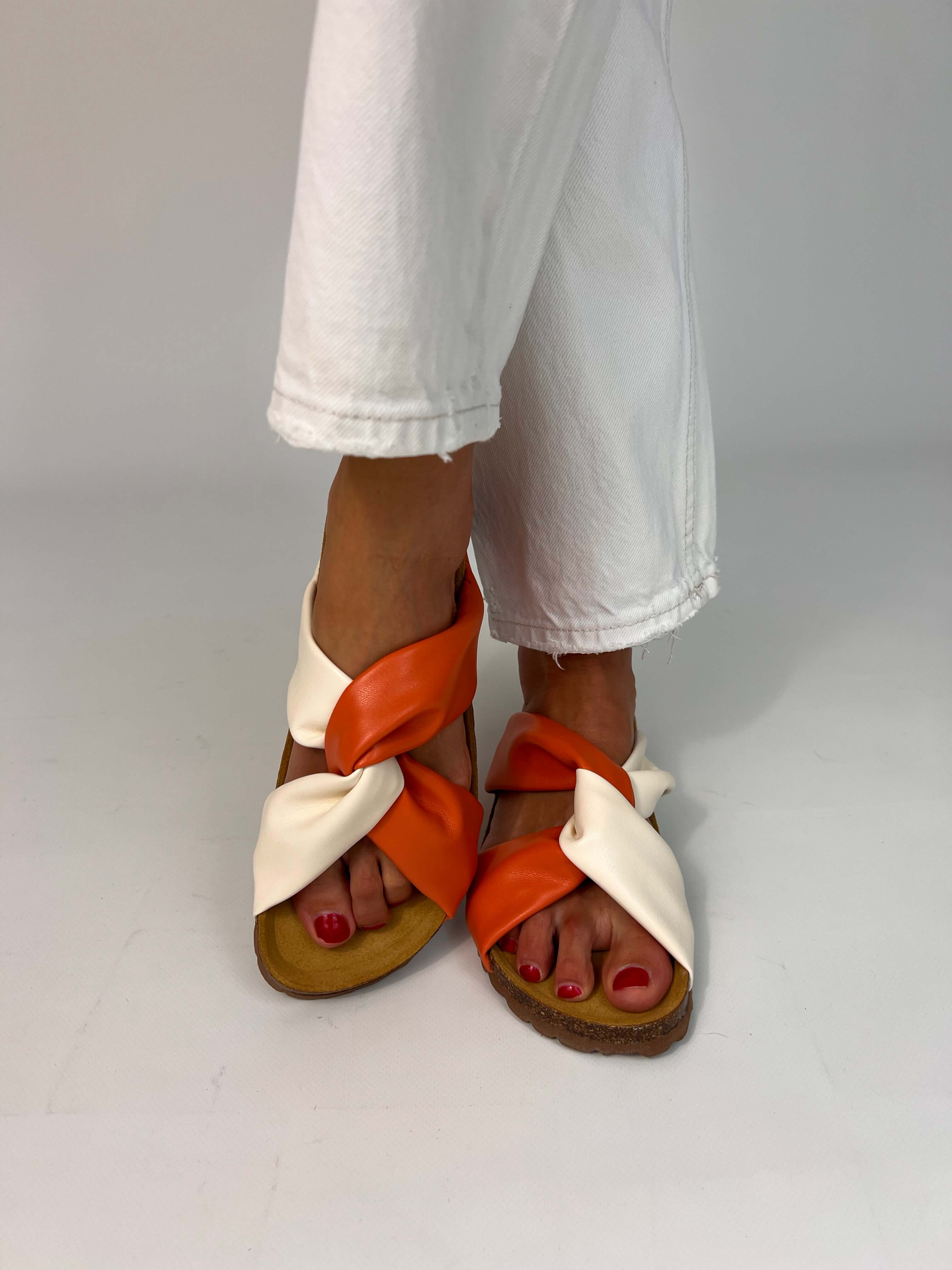 Momoc Calpe orange knotted sandals worn white jeans outfit summer lifestyle full view | Momoc Shoes