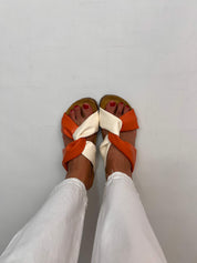 Momoc Calpe orange cream knotted sandals worn front view white trousers cork sole sustainable Spain | Momoc Shoes Spain