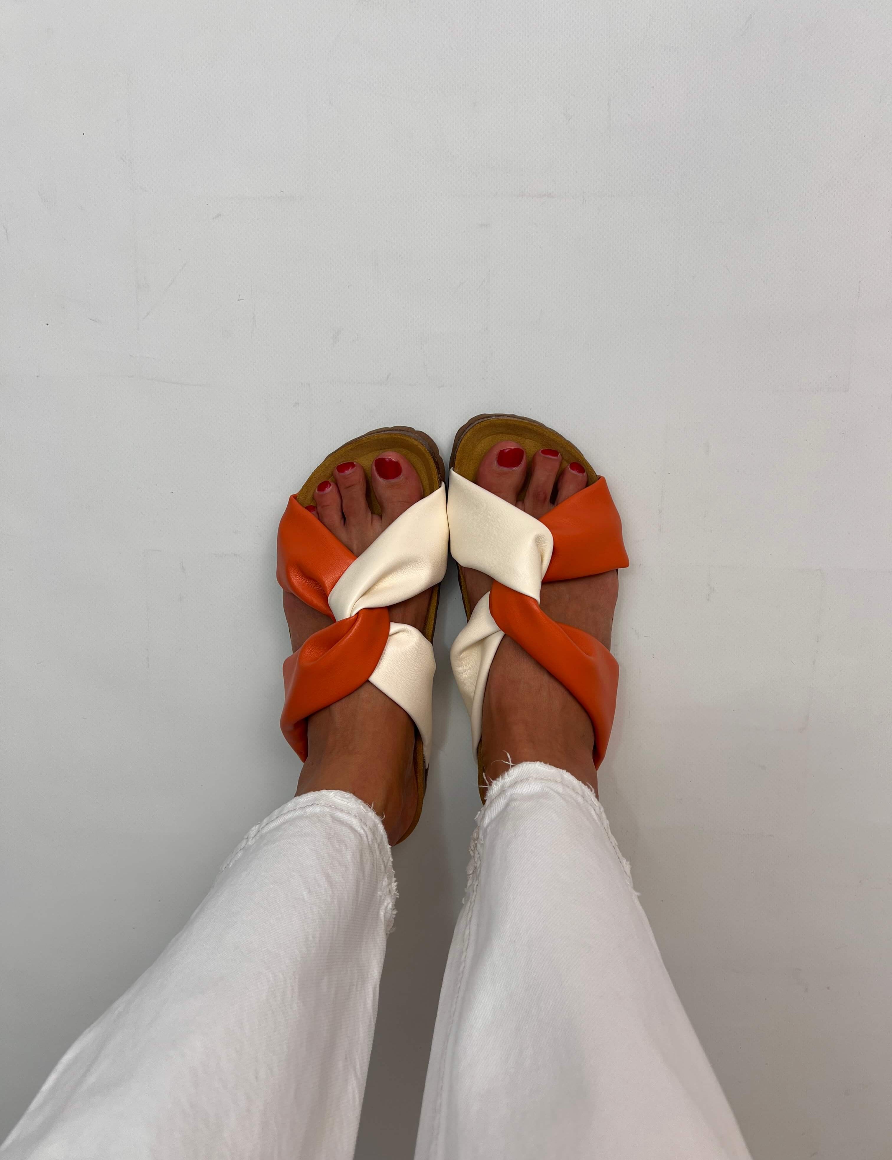 Momoc Calpe orange cream knotted sandals worn front view white trousers cork sole sustainable Spain | Momoc Shoes Spain