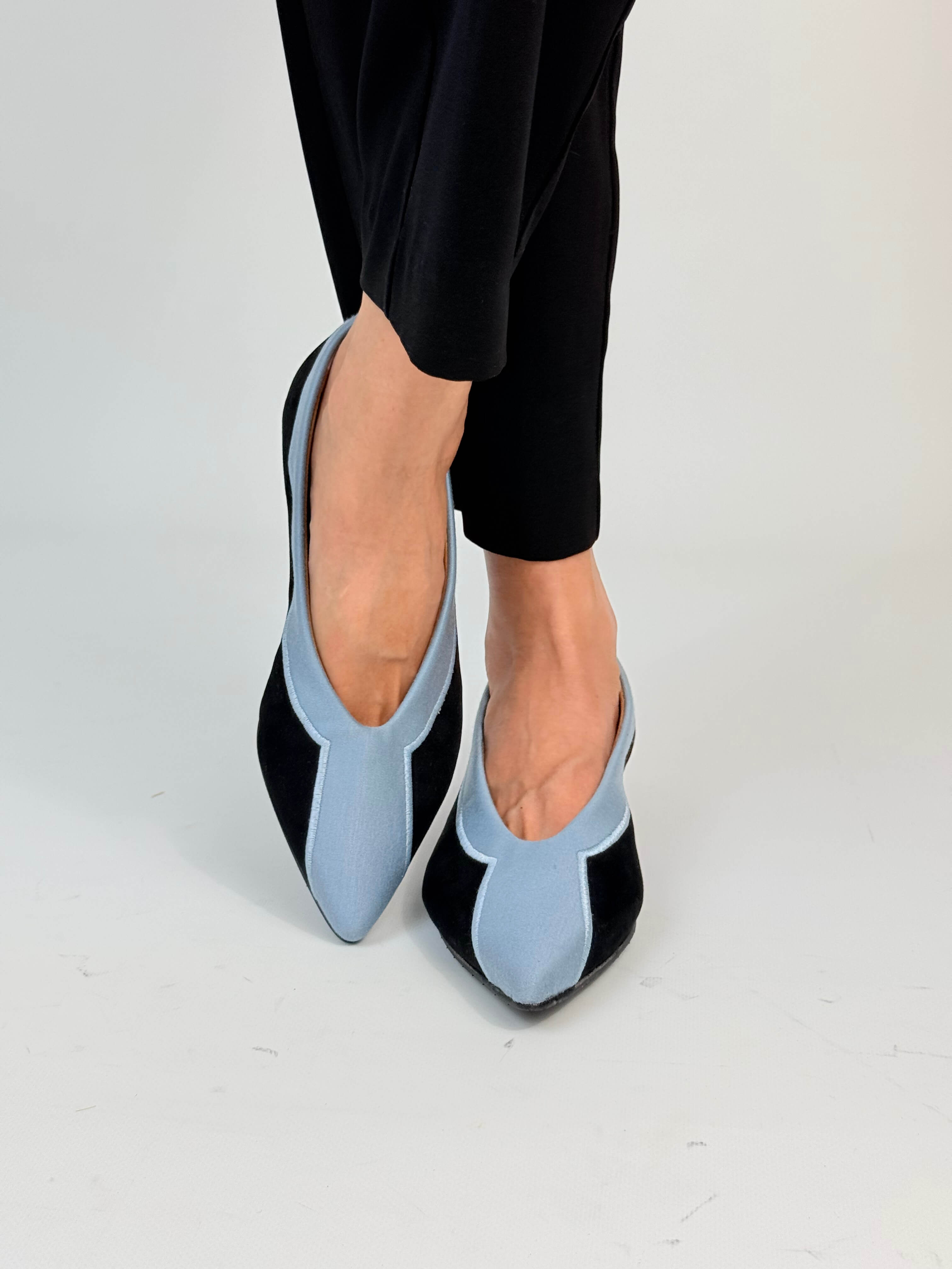 Momoc Coral Reef Blue ballet flats worn walking pose black trousers Leticia Credidio fabric Spain | Momoc Shoes Spain