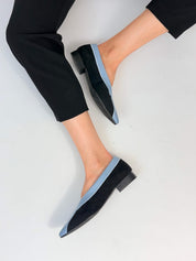 Momoc Coral Reef Blue ballet flats worn back view raised foot black trousers lifestyle Spain | Momoc Shoes