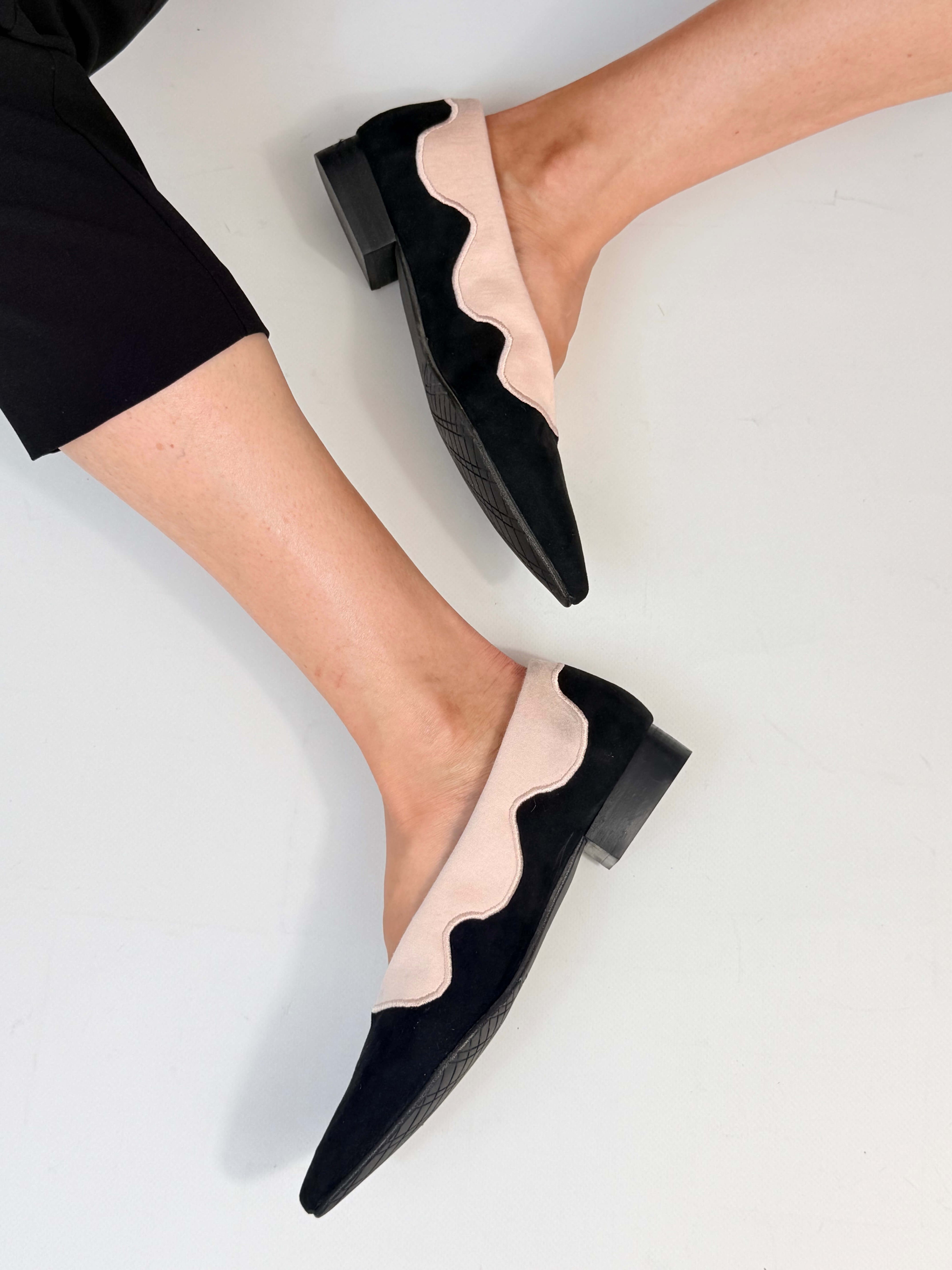 Momoc Sea Breeze black cotton velvet ballet flats worn back view raised foot black trousers lifestyle Spain | Momoc Shoes
