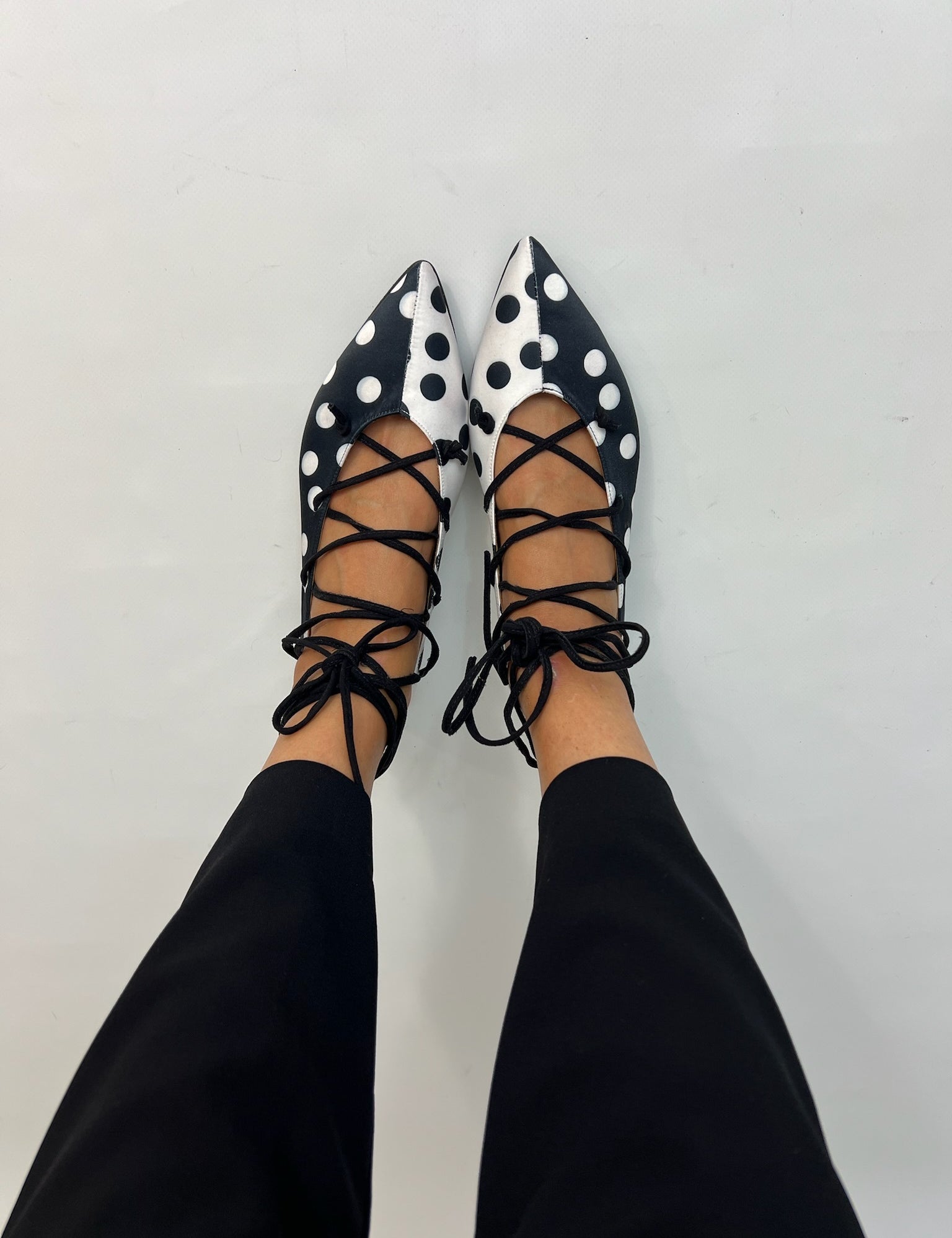 Momoc Carmen polka dot ballet flats worn top view black trousers lace-up ties Spain | Momoc Shoes Spain