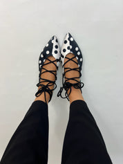 Momoc Carmen polka dot ballet flats worn top view black trousers lace-up ties Spain | Momoc Shoes Spain