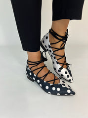 Momoc Carmen polka dot ballet flats worn front view black trousers ankle lace-up detail Spain | Momoc Shoes Spain