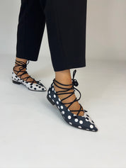 Momoc Carmen polka dot ballet flats worn side view black trousers lace-up cords crossed detail | Momoc Shoes