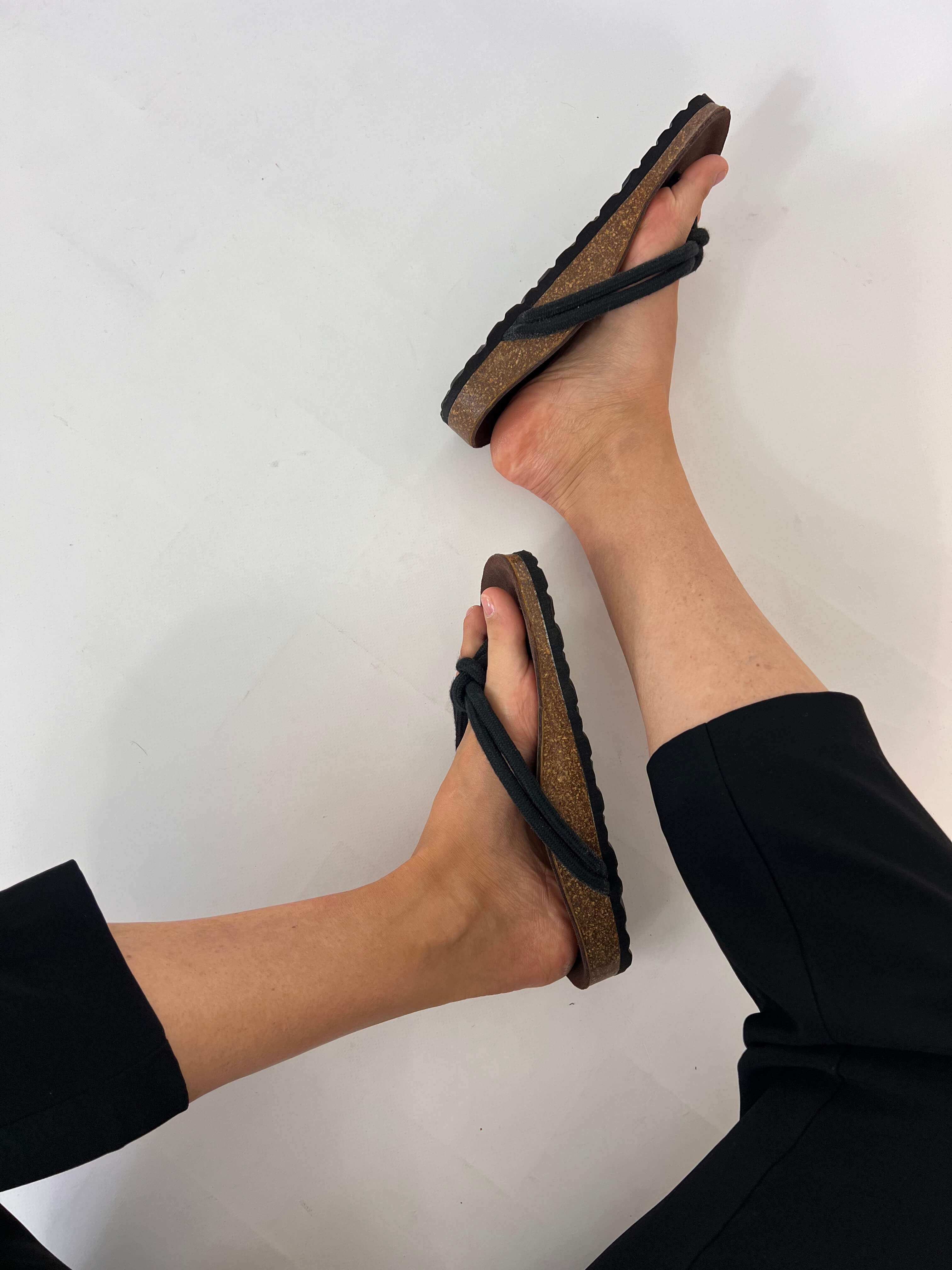 Momoc Javea black cotton rope sandal side profile black trousers artisan knot detail | Momoc Shoes