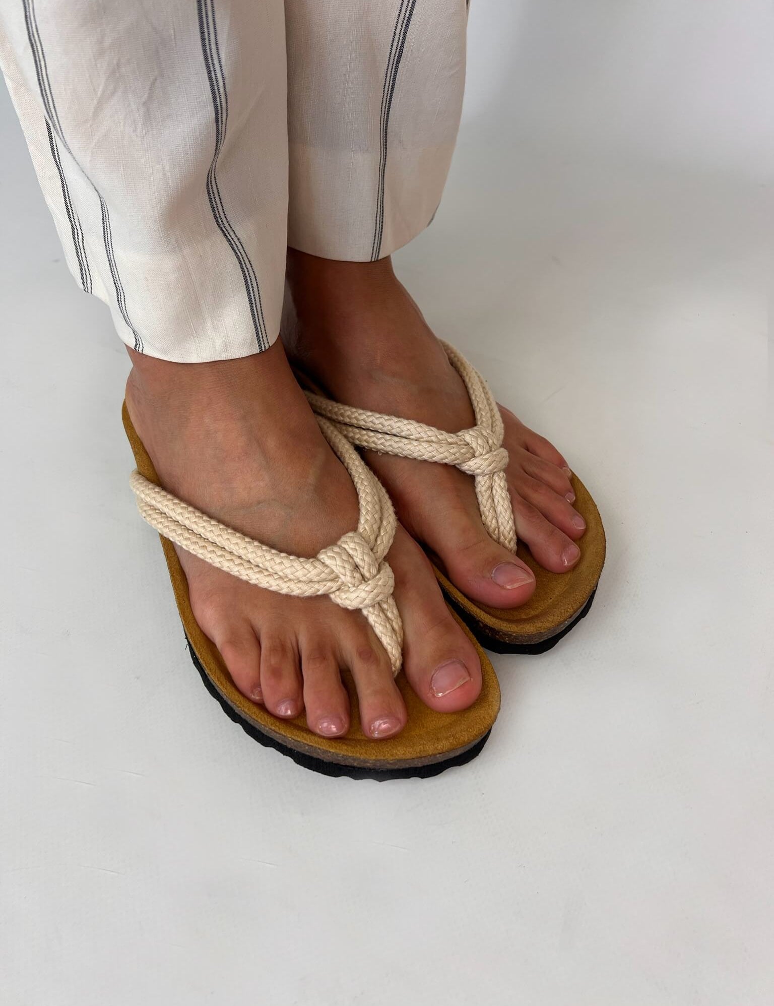 Momoc Javea natural rope sandal worn side view striped white trousers cork sole sustainable | Momoc Shoes Spain
