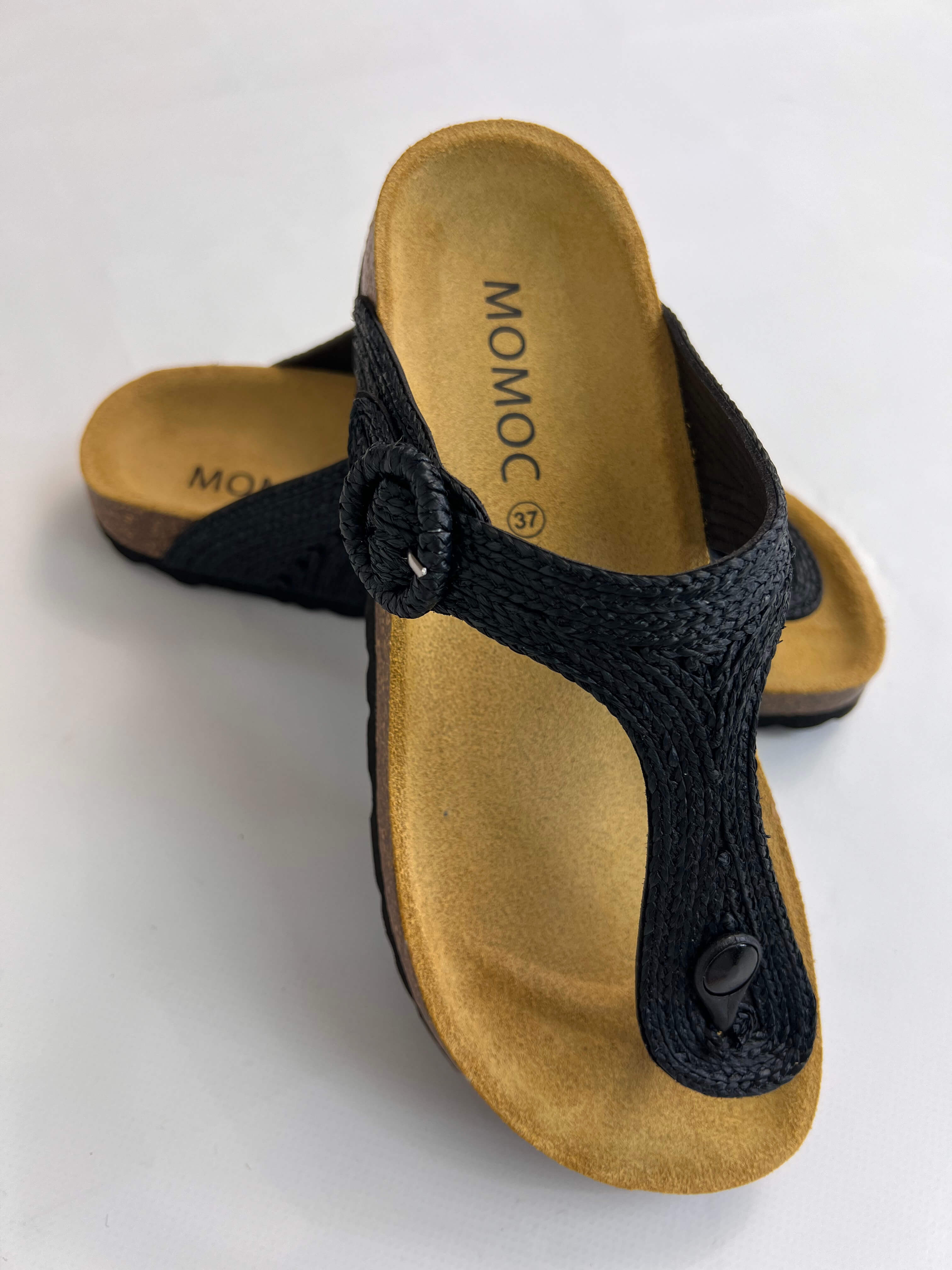 Momoc Altea black raffia thong sandal angled view cork latex sole recycled EVA Spain | Momoc Shoes